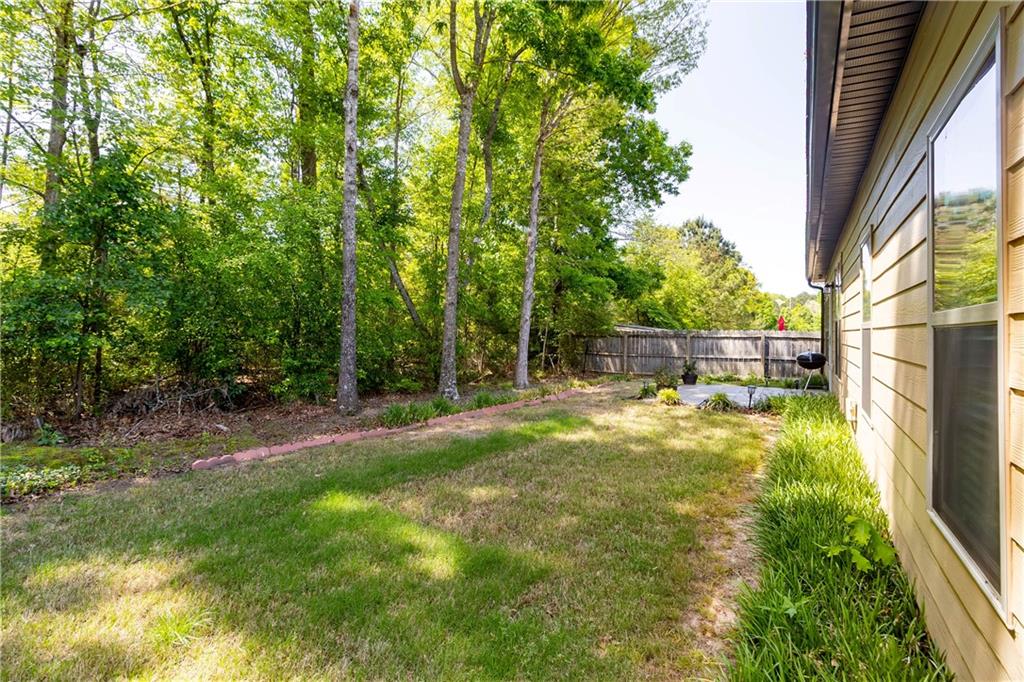 70 Sylvan Loop Fayetteville, GA 30214 - Photo 40 of 40 a view of backyard with swimming pool and trees in the background
