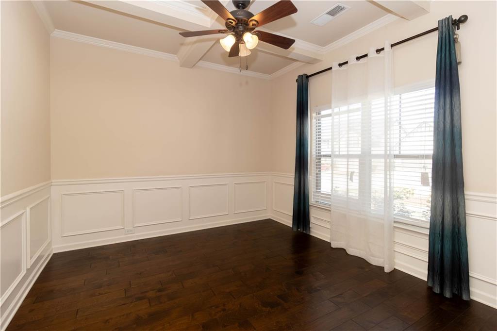 70 Sylvan Loop Fayetteville, GA 30214 - Photo 7 of 40 an empty room with wooden floor fan and windows