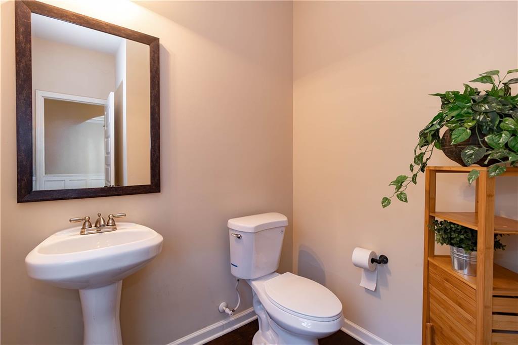 70 Sylvan Loop Fayetteville, GA 30214 - Photo 9 of 40 a bathroom with a toilet sink and shower