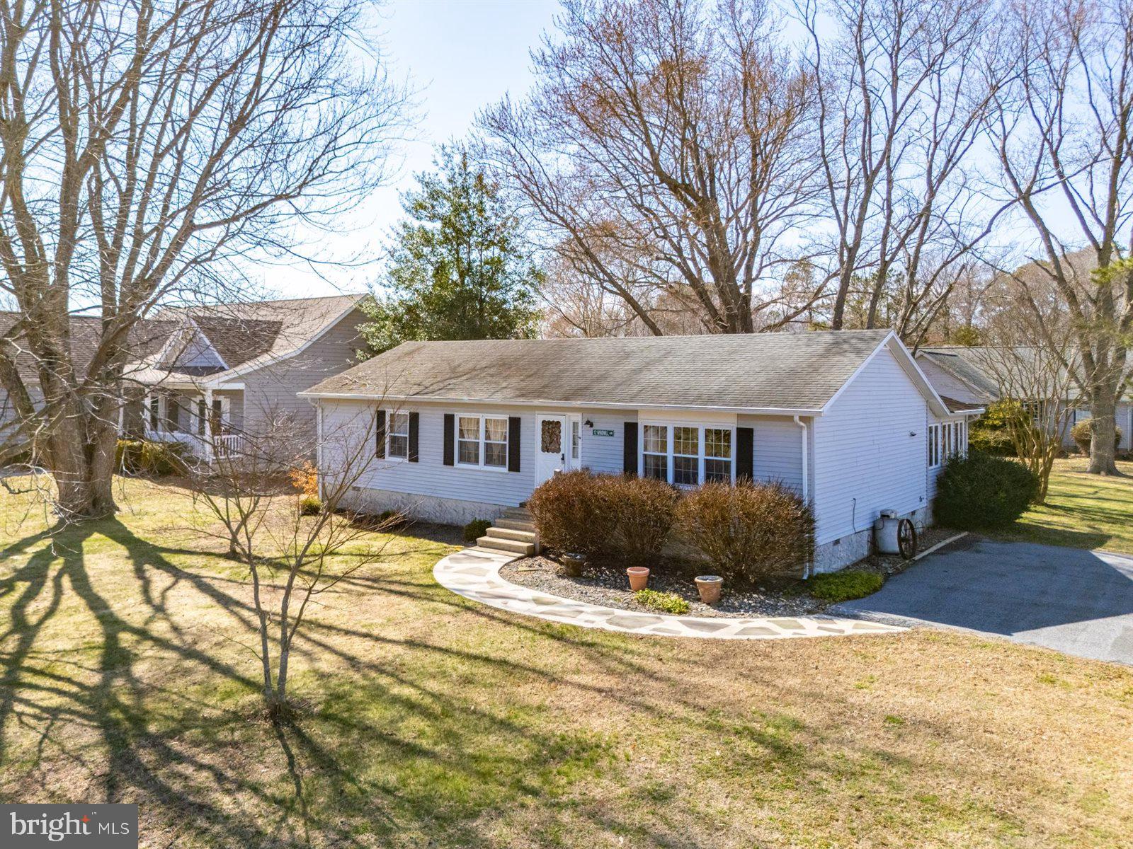 12 Windmill Lane Ocean View, DE 19970 - Photo 1 of 54 a front view of a house with a yard covered in snow