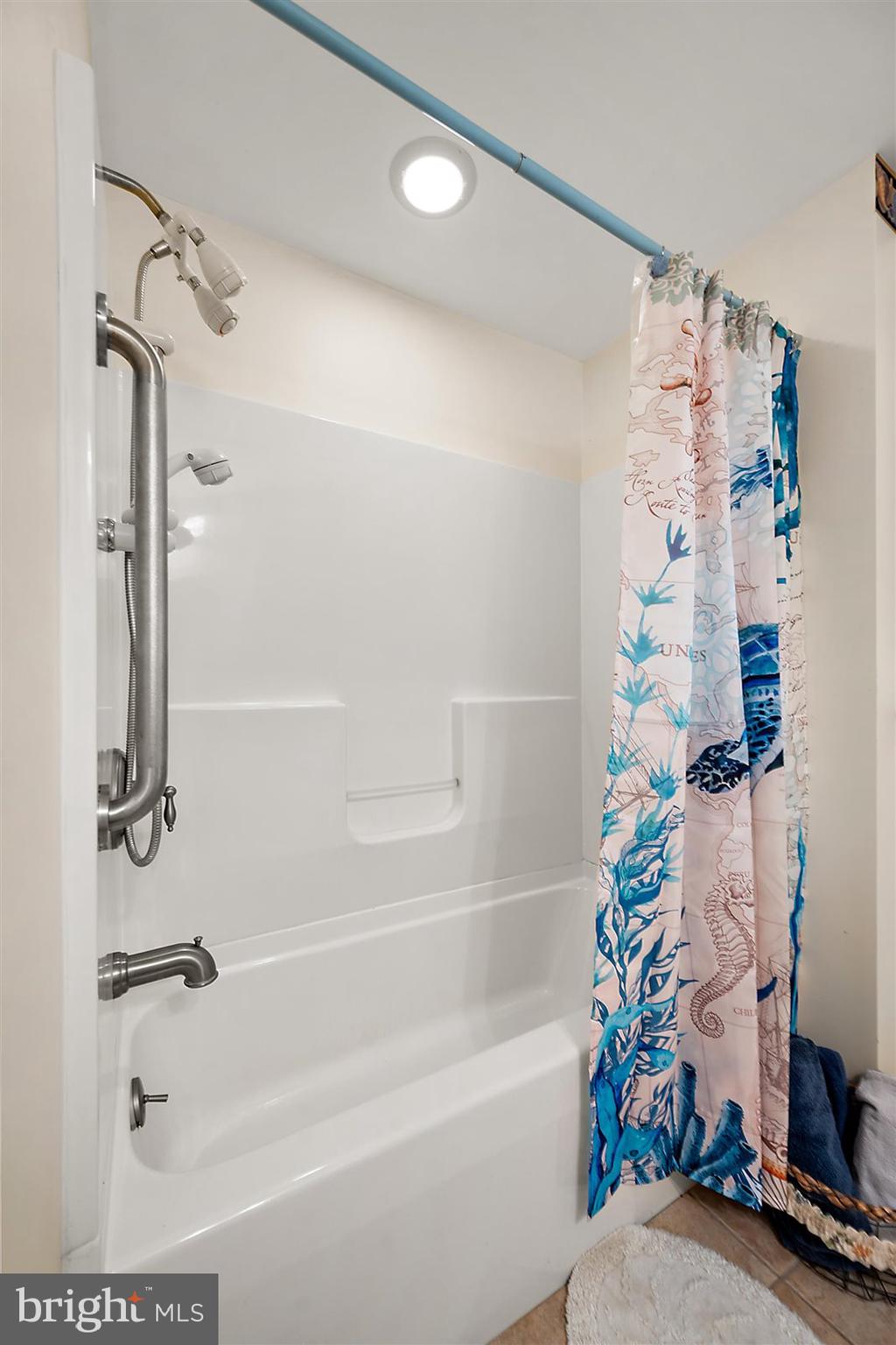 12 Windmill Lane Ocean View, DE 19970 - Photo 28 of 54 a bathroom with a bathtub a sink and a shower