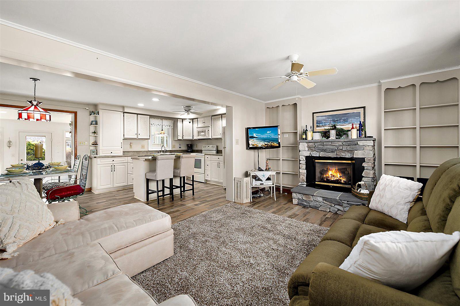 12 Windmill Lane Ocean View, DE 19970 - Photo 4 of 54 a living room with furniture and a fireplace