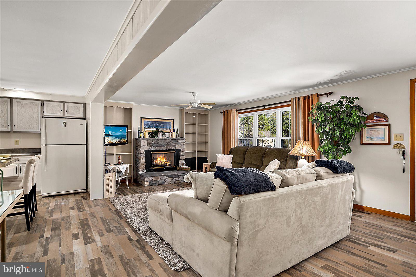 12 Windmill Lane Ocean View, DE 19970 - Photo 6 of 54 a living room with furniture and a flat screen tv