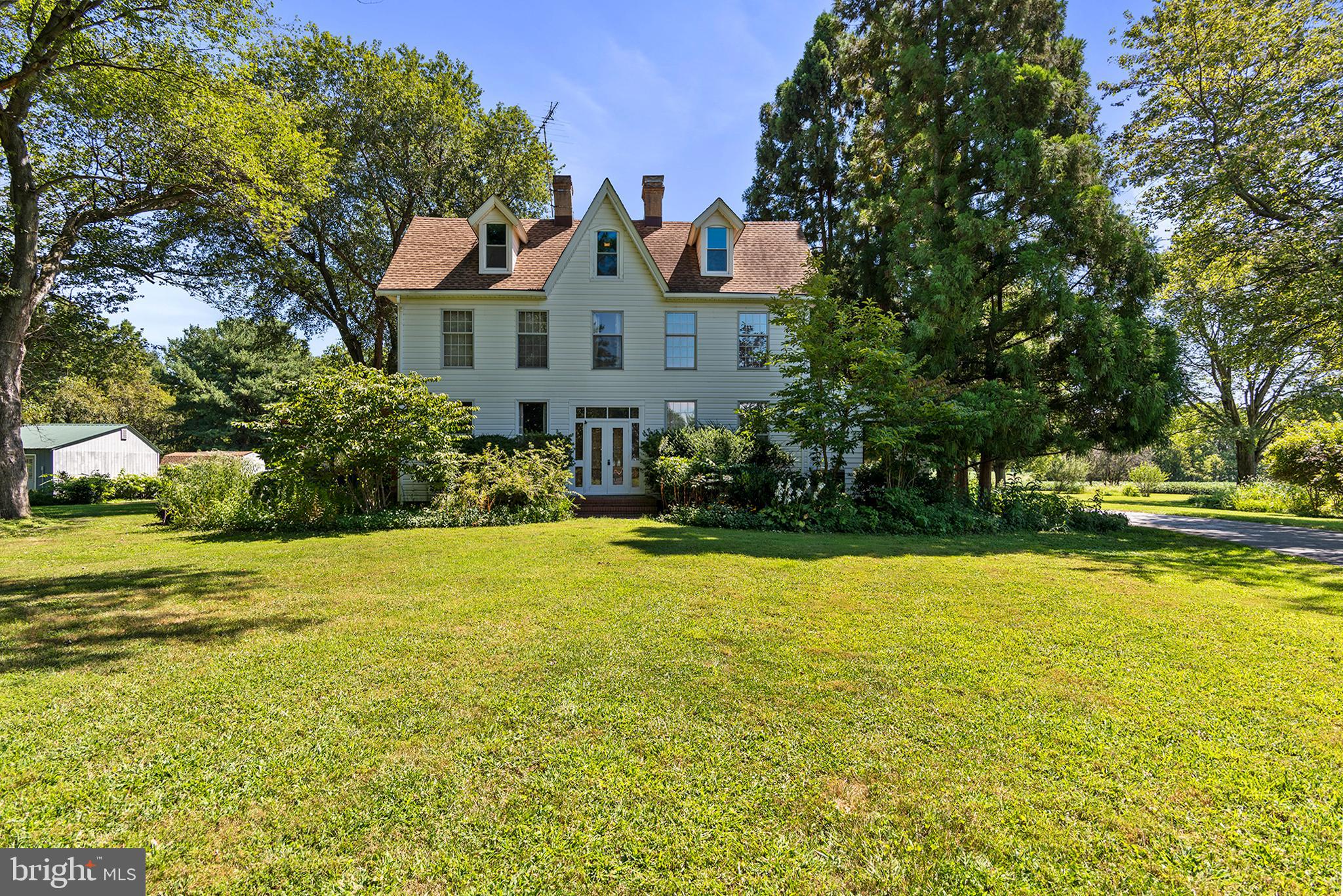 8293 Brices Mill Road Chestertown, MD 21620 - Photo 1 of 59 a front view of house with yard and trees