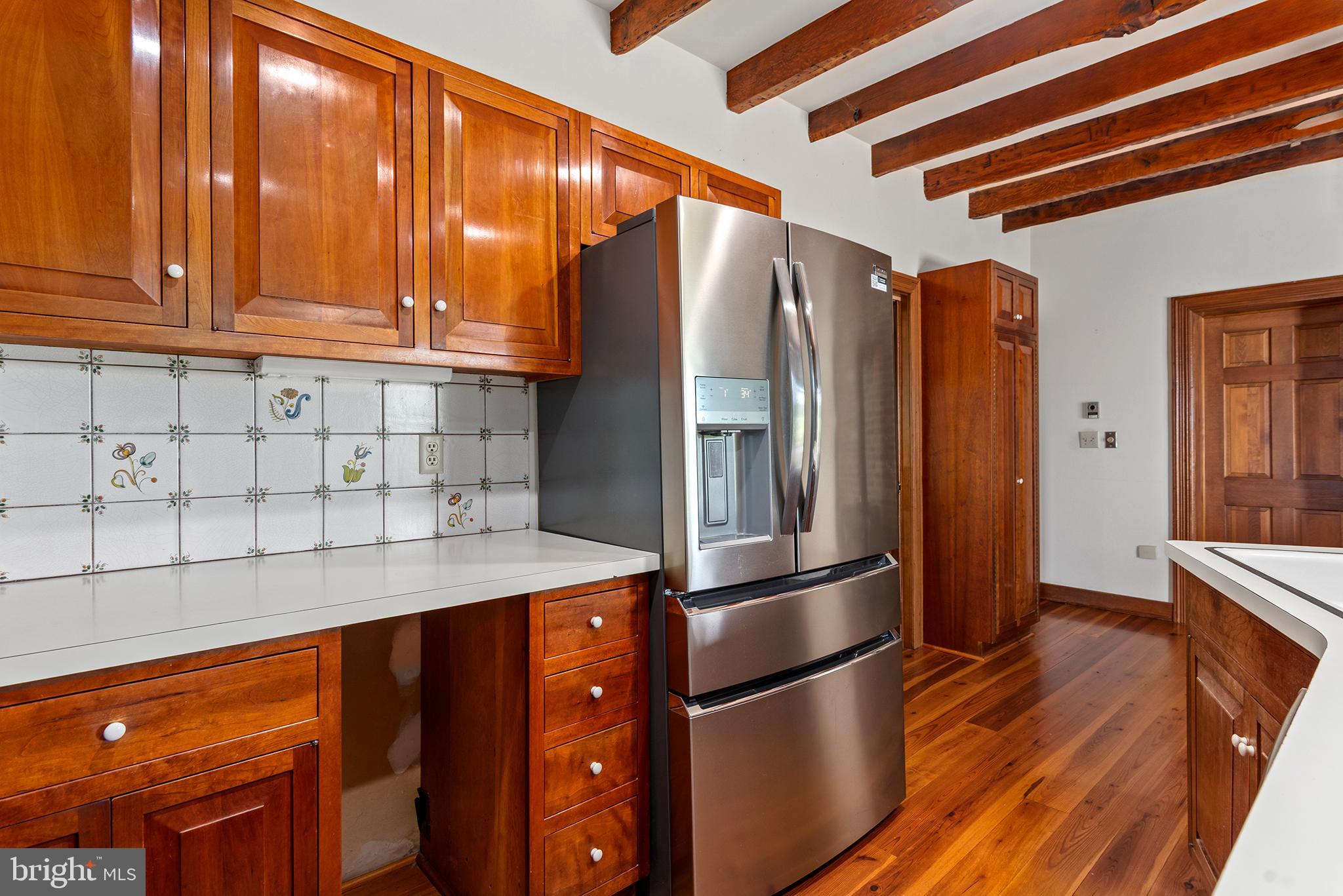 8293 Brices Mill Road Chestertown, MD 21620 - Photo 20 of 59 a kitchen with stainless steel appliances granite countertop a refrigerator and a sink