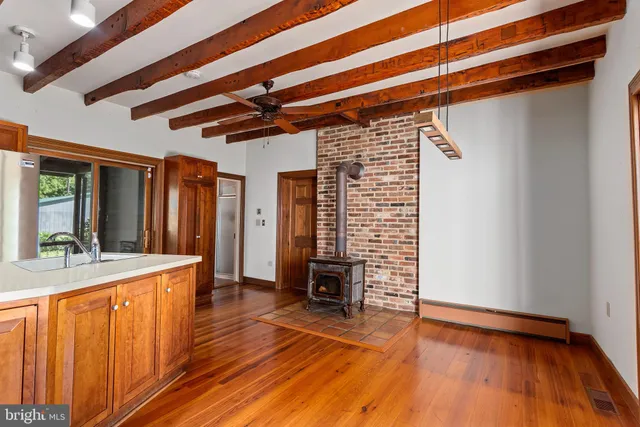 a view of a living room with hardwood floor