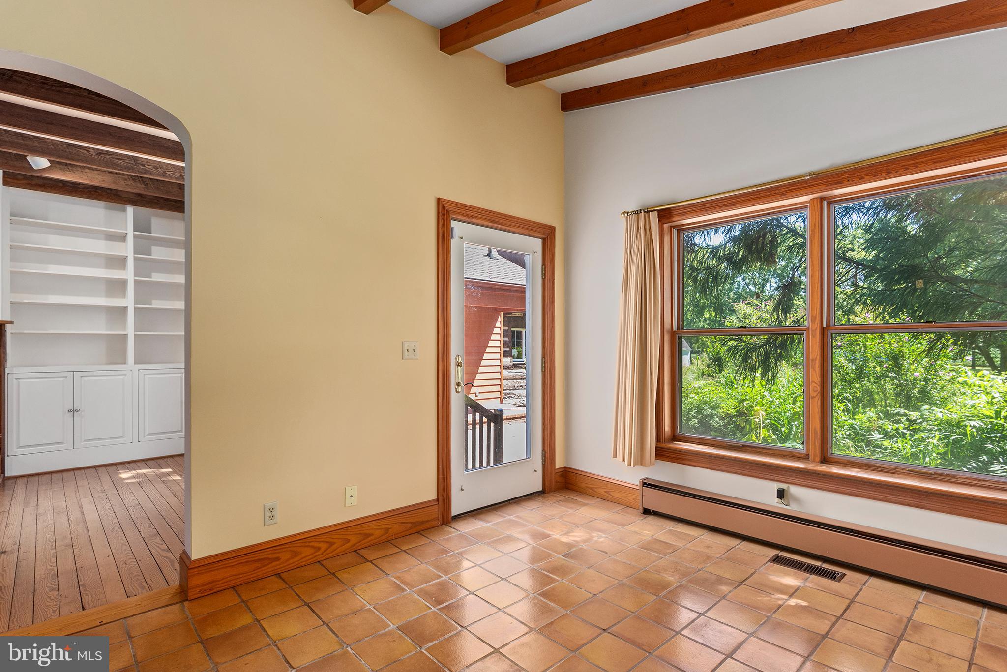 8293 Brices Mill Road Chestertown, MD 21620 - Photo 27 of 59 a view of an empty room with wooden floor and windows