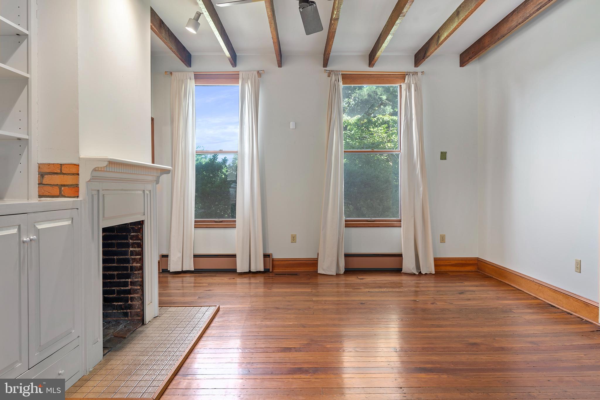 8293 Brices Mill Road Chestertown, MD 21620 - Photo 28 of 59 a view of empty room with wooden floor and fan