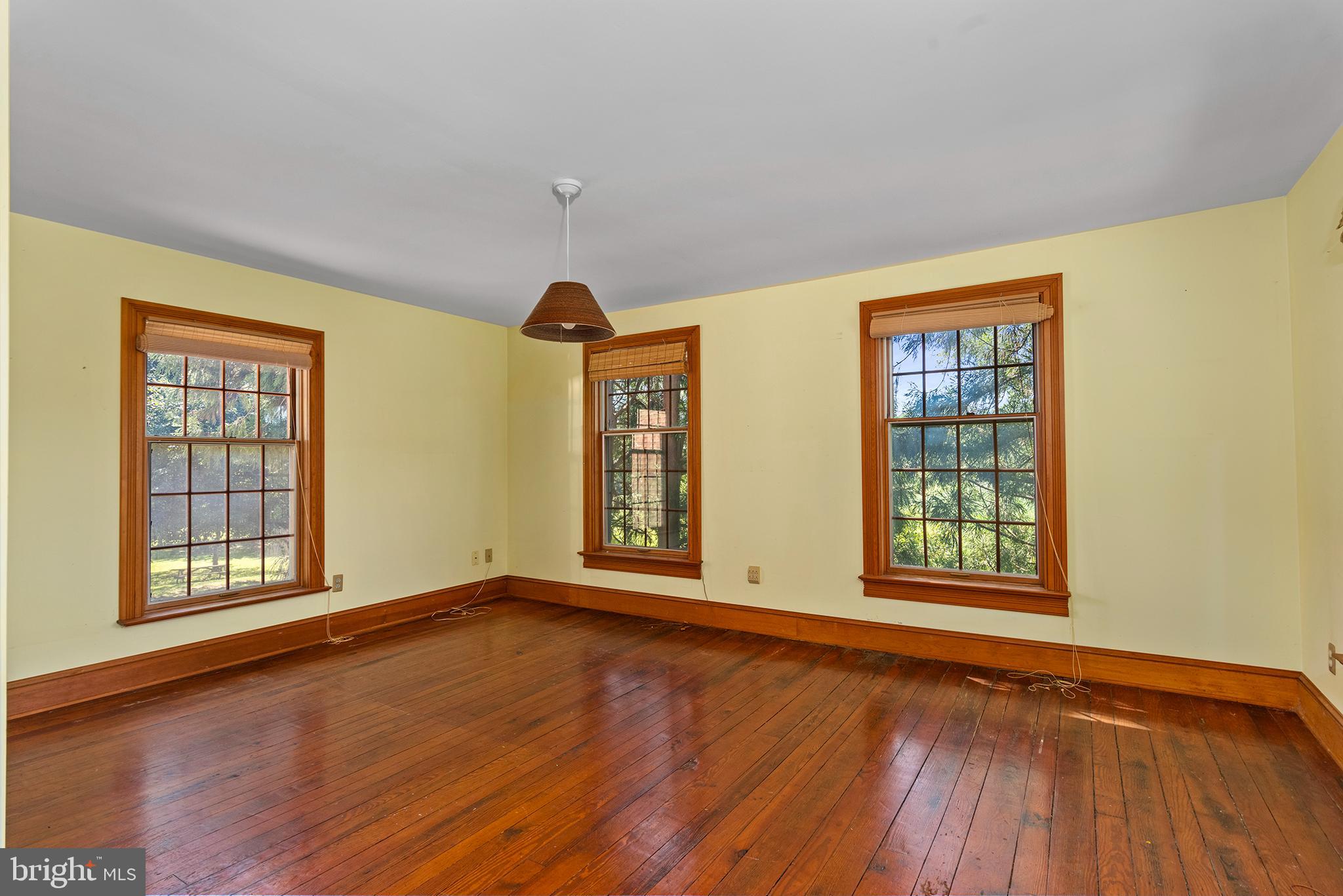 8293 Brices Mill Road Chestertown, MD 21620 - Photo 30 of 59 an empty room with wooden floor and windows