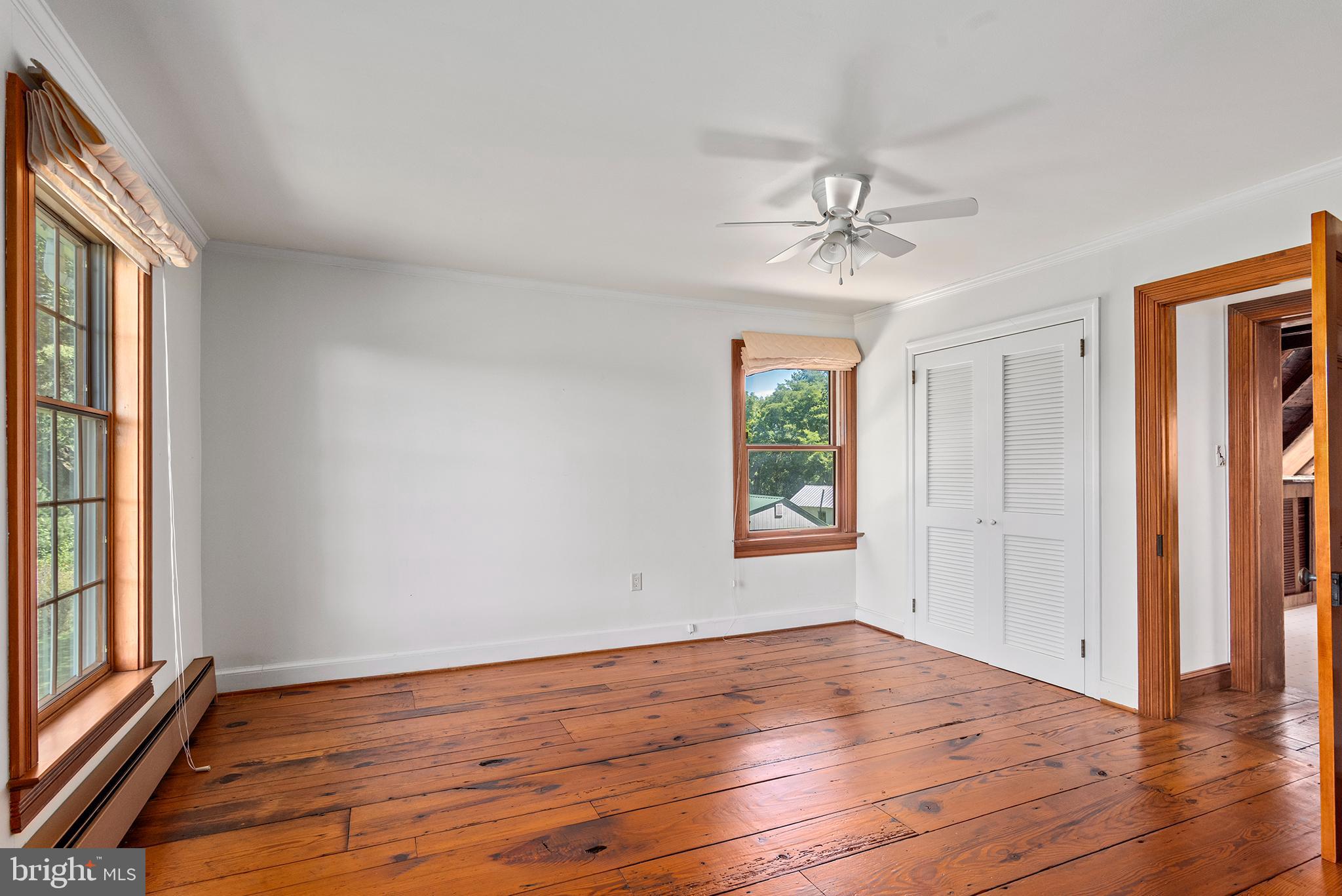 8293 Brices Mill Road Chestertown, MD 21620 - Photo 50 of 59 wooden floor in an empty room with a window