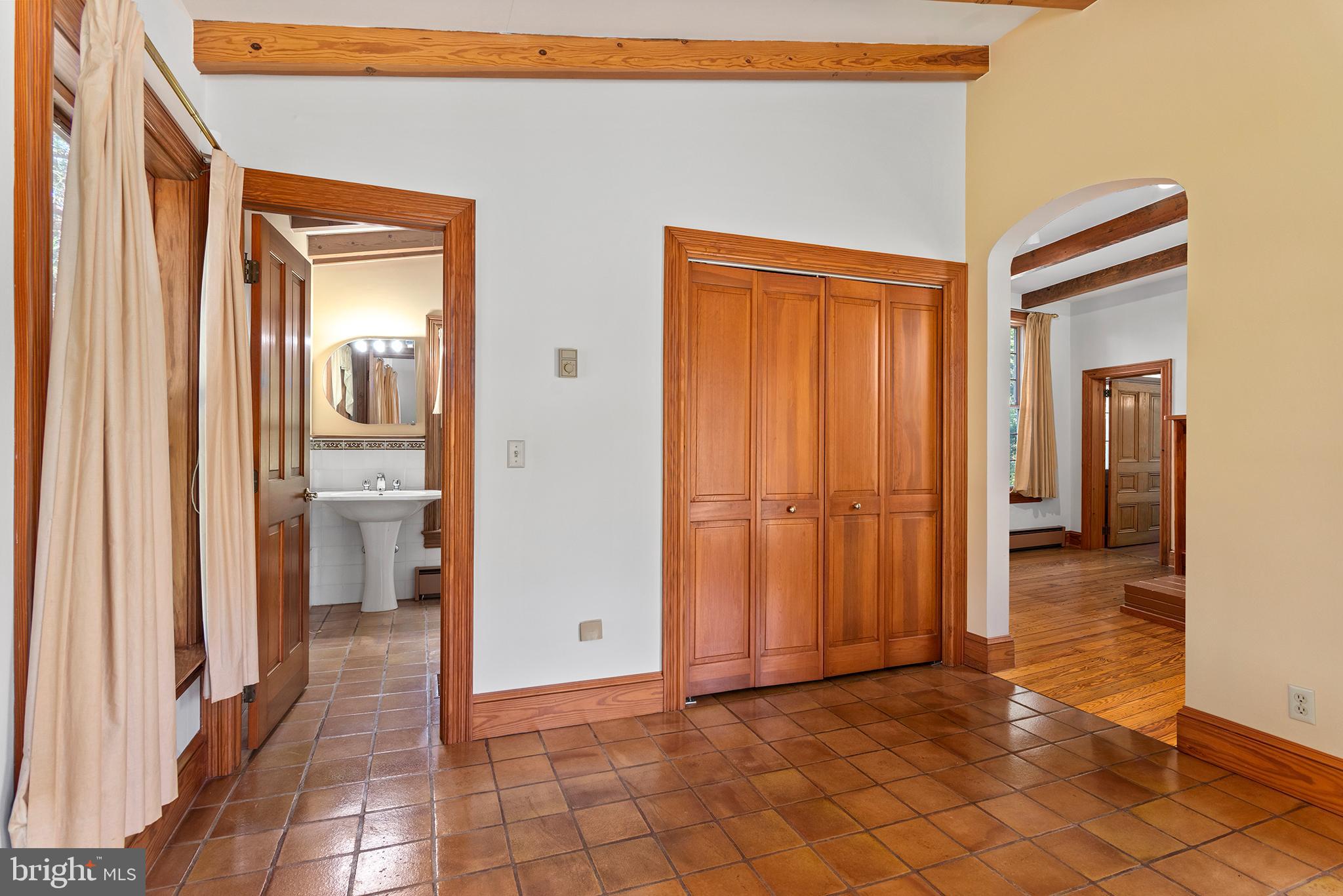 8293 Brices Mill Road Chestertown, MD 21620 - Photo 58 of 59 a view of a hallway with wooden floor and a bathroom