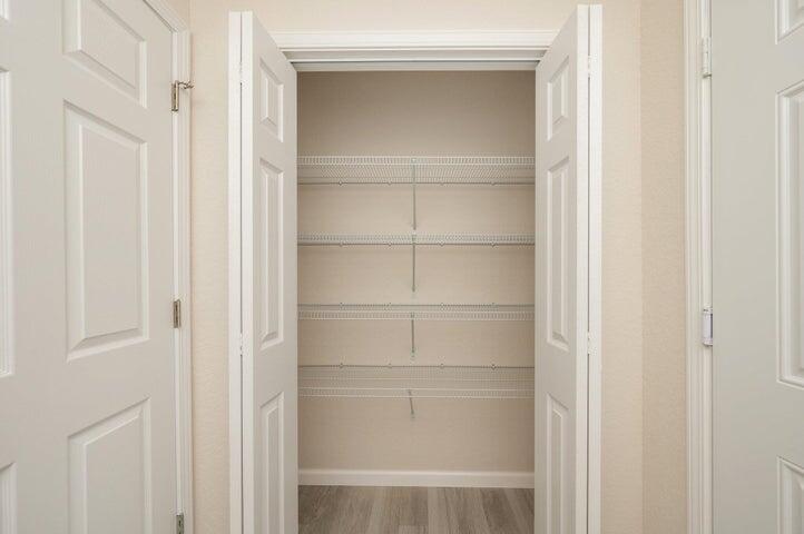 615 East Chestnut Avenue Crestview, FL 32539 - Photo 5 of 10 a view of walk in closet with empty racks