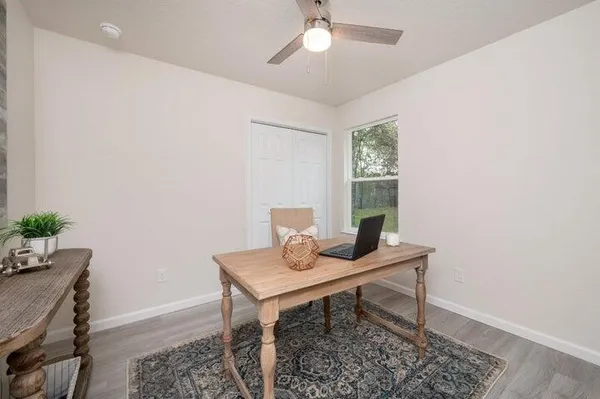a workspace with furniture and window