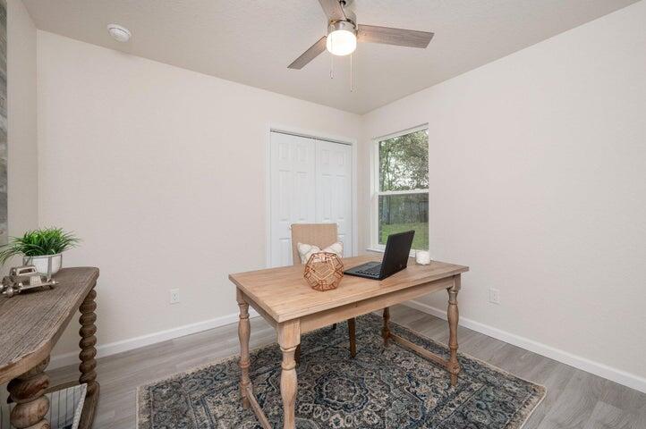 615 East Chestnut Avenue Crestview, FL 32539 - Photo 8 of 10 a workspace with furniture and window