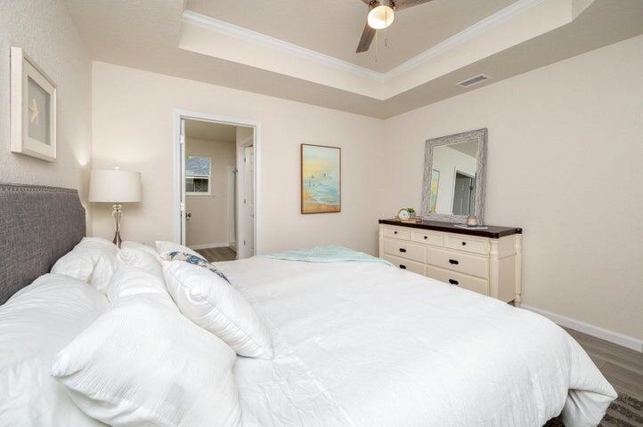 615 East Chestnut Avenue Crestview, FL 32539 - Photo 9 of 10 a bedroom with a bed and a night stand