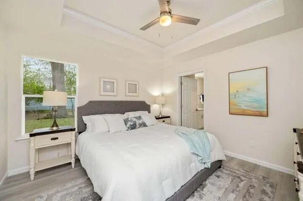 a bedroom with a large bed and a window