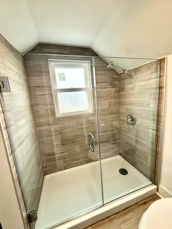 a bathroom with a shower and bathtub