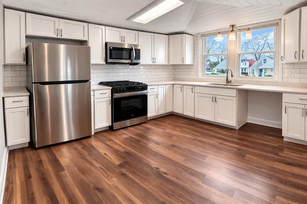 a kitchen with a refrigerator stove and sink