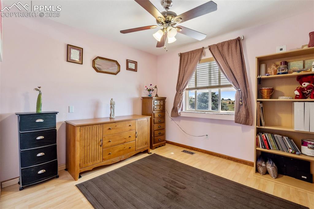 18895 Sage Crest Road Peyton, CO 80831 - Photo 15 of 38 a living room with hard wood floors and a window