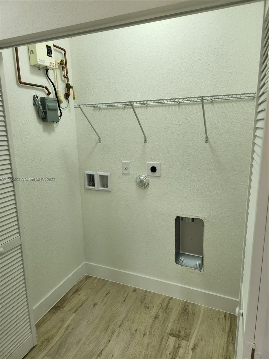 22065 Miami Avenue Miami, FL 33170 - Photo 12 of 27 a view of a room with rack on the wall