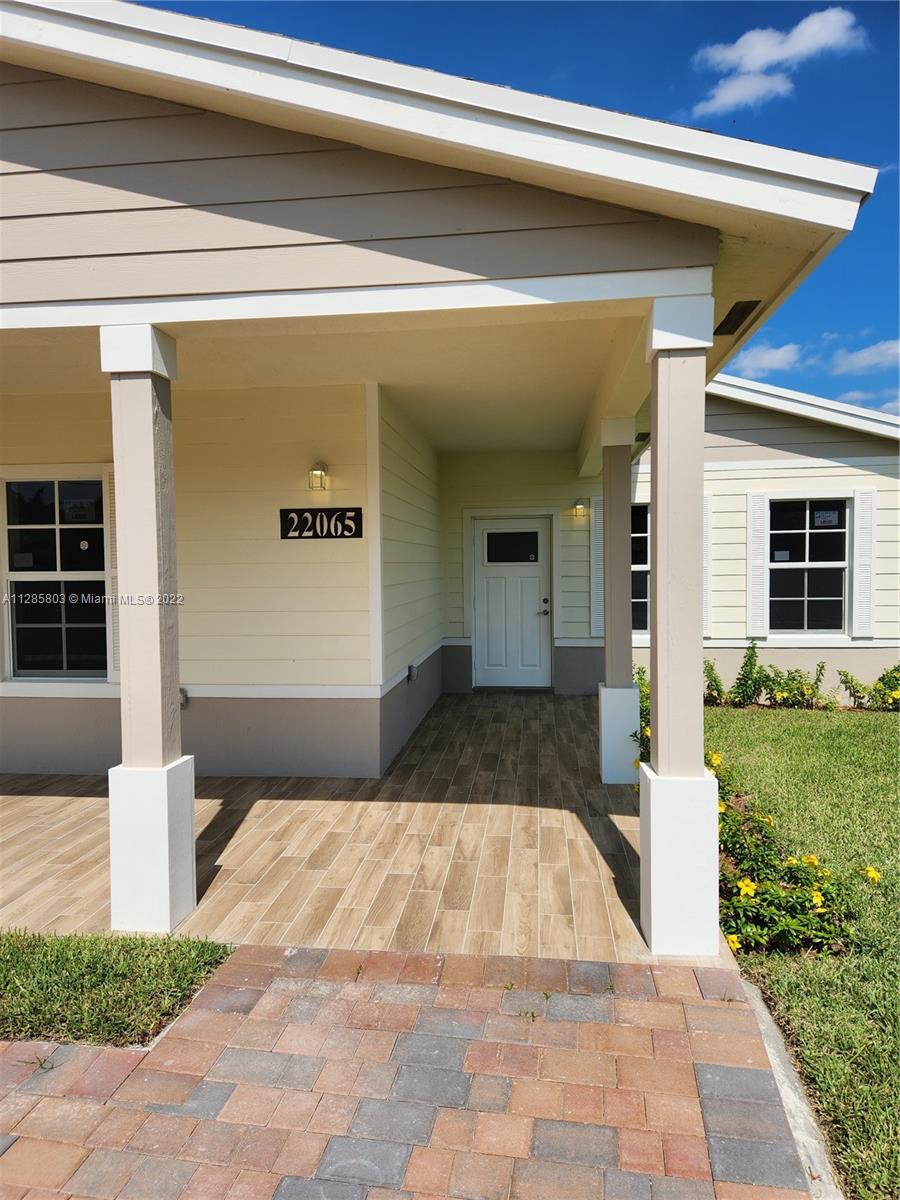 22065 Miami Avenue Miami, FL 33170 - Photo 2 of 27 a front view of a house