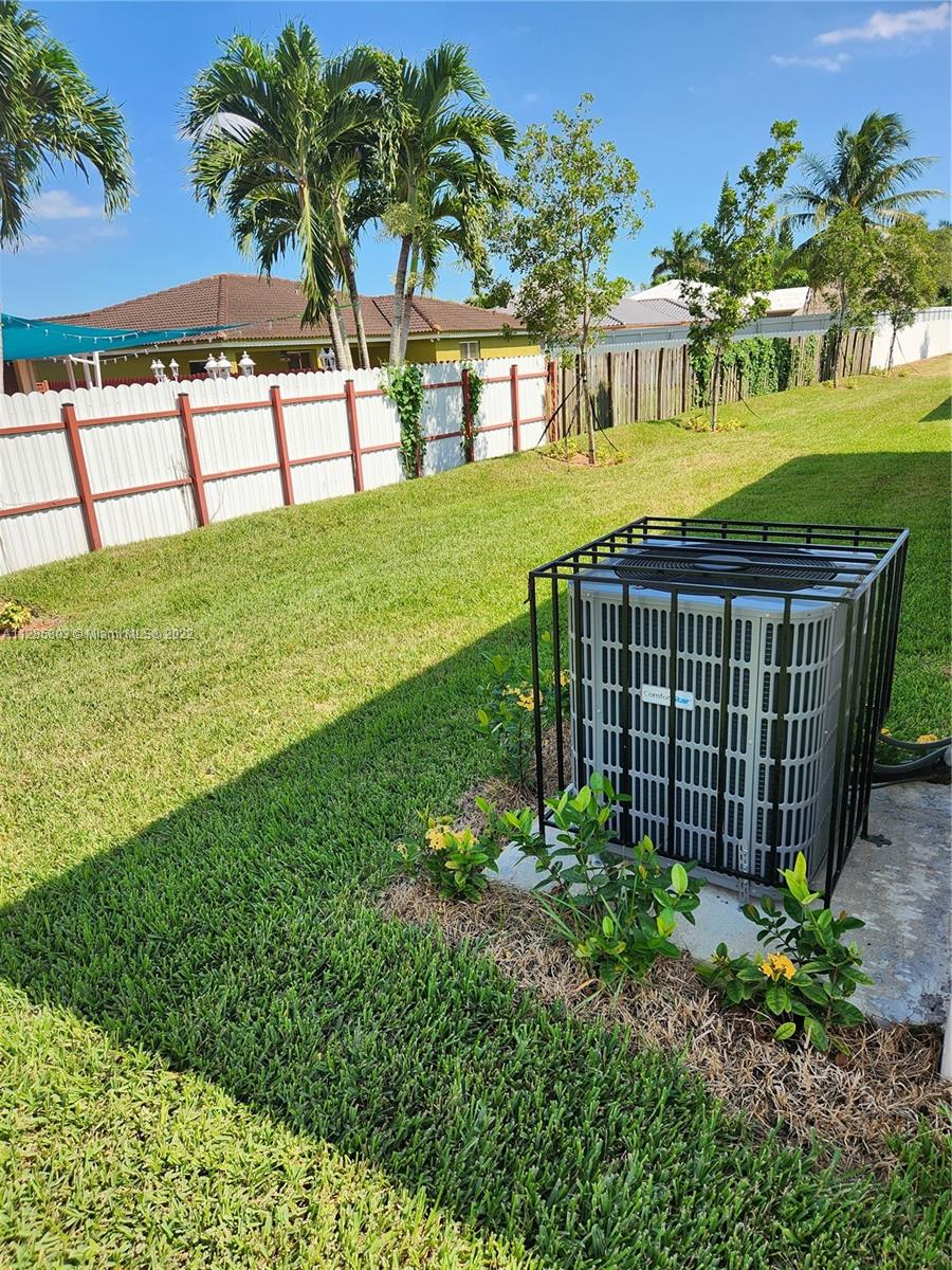 22065 Miami Avenue Miami, FL 33170 - Photo 7 of 27 a view of a house with a garden
