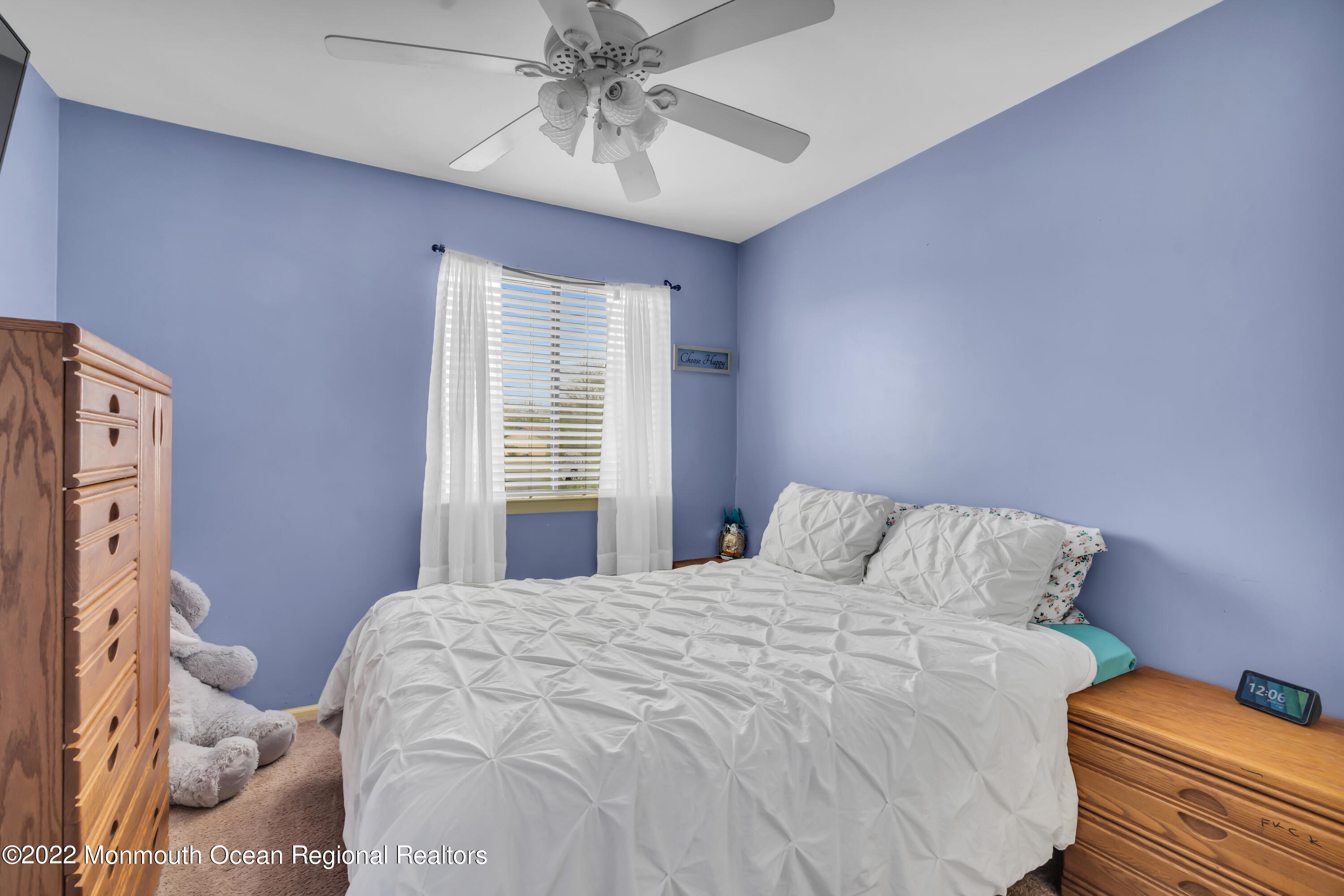 7 Jesse Drive Howell, NJ 07731 - Photo 12 of 25 a bedroom with a bed and a chandelier