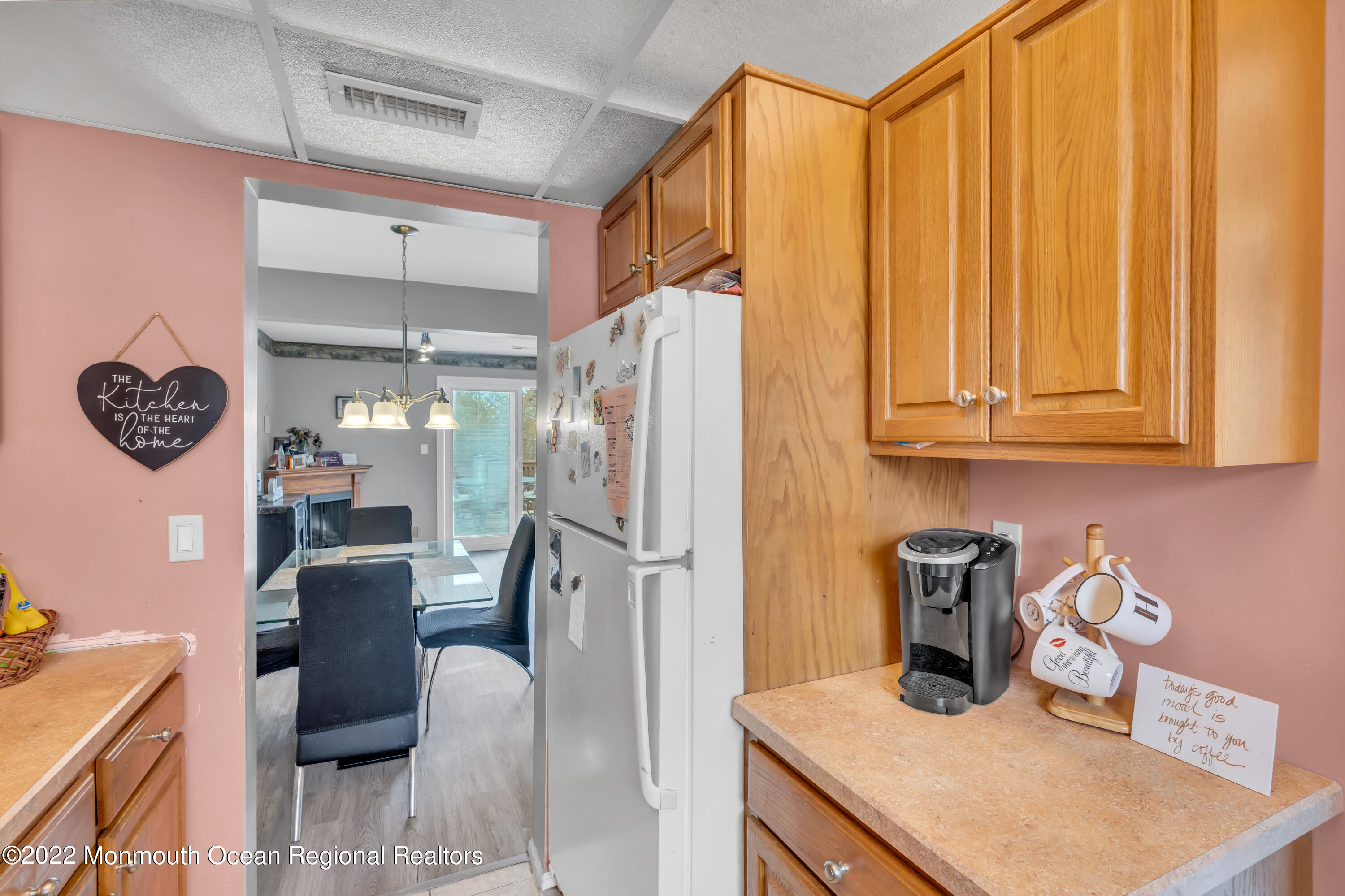 7 Jesse Drive Howell, NJ 07731 - Photo 18 of 25 a kitchen with refrigerator and cabinets