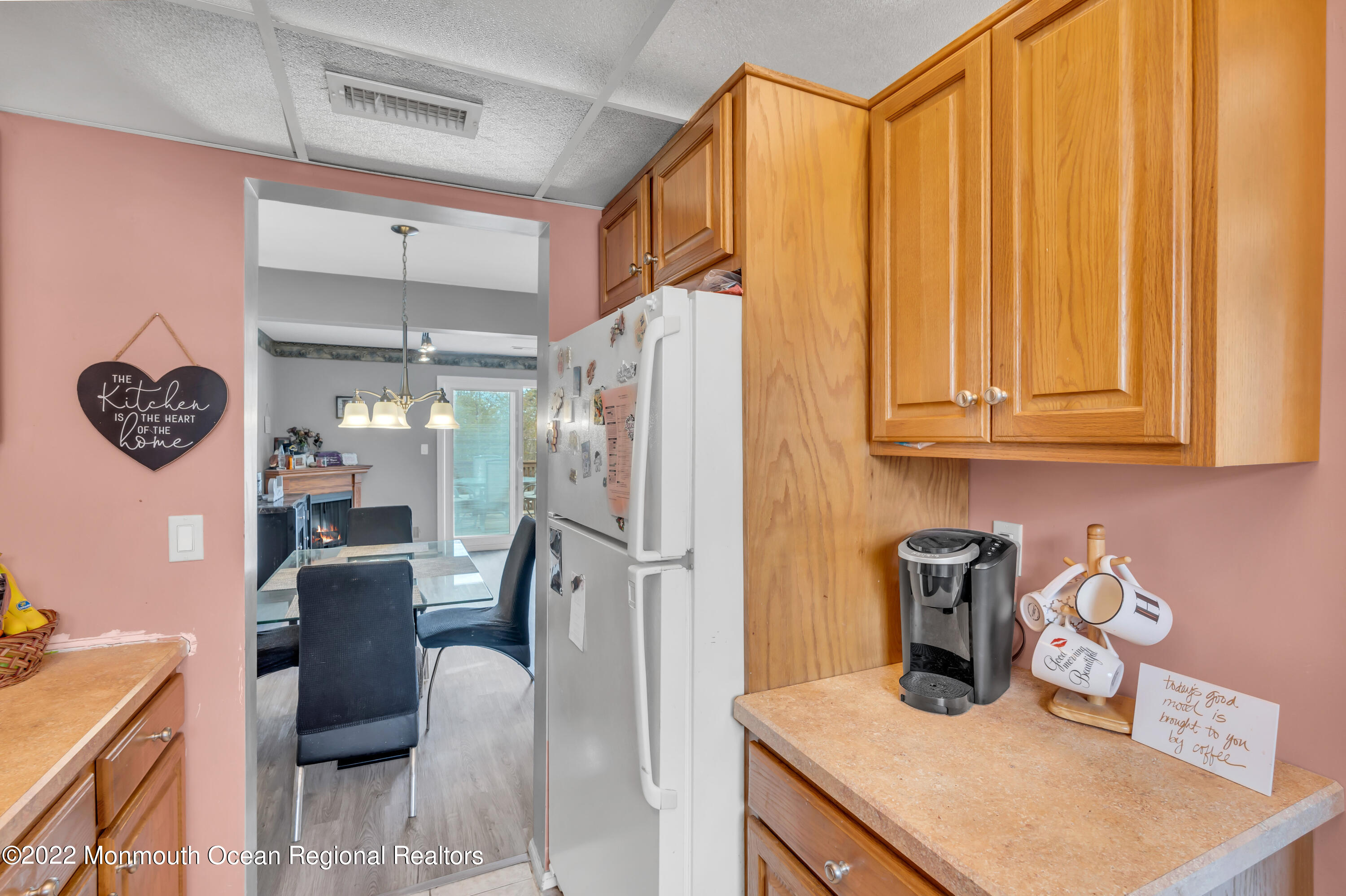 7 Jesse Drive Howell, NJ 07731 - Photo 19 of 25 a kitchen with refrigerator and cabinets
