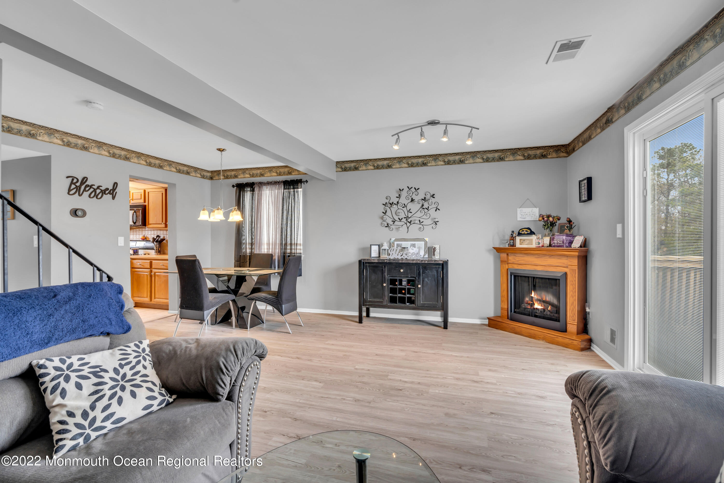 7 Jesse Drive Howell, NJ 07731 - Photo 10 of 25 a living room with furniture and a fireplace
