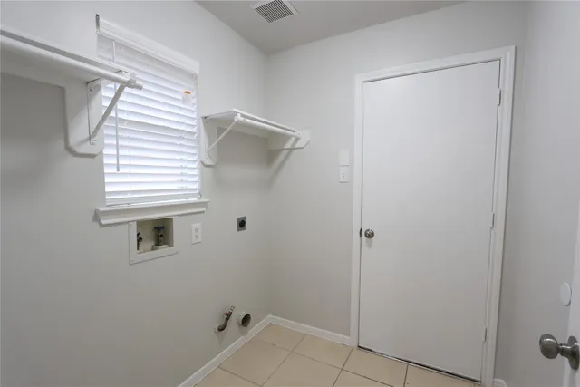 a bathroom with a shower and a window