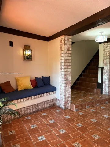 a living room with furniture and a rug