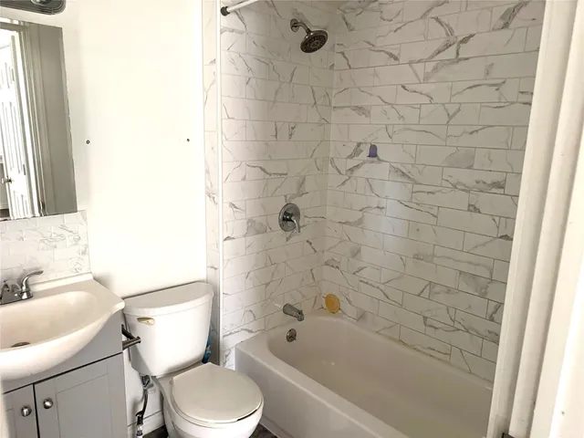 a bathroom with a toilet and a sink