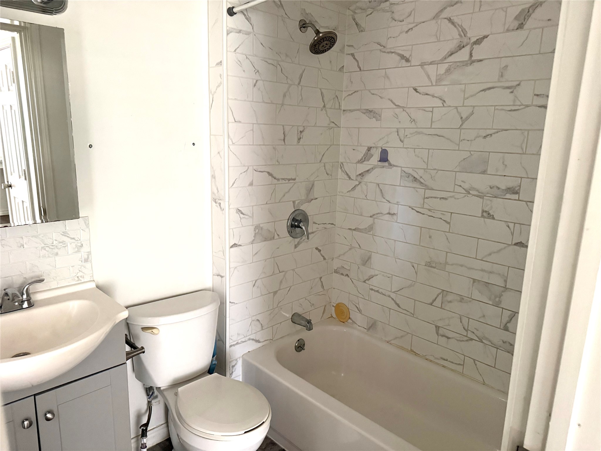 4730 Oleander Street Bacliff, TX 77518 - Photo 16 of 18 a bathroom with a toilet and a sink