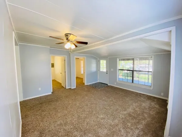 a view of an empty room with a window