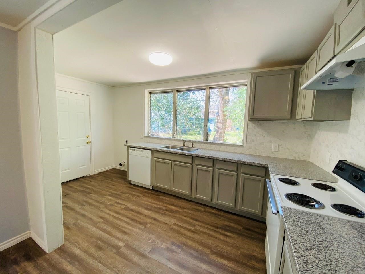 4730 Oleander Street Bacliff, TX 77518 - Photo 7 of 18 a kitchen with a stove and a sink