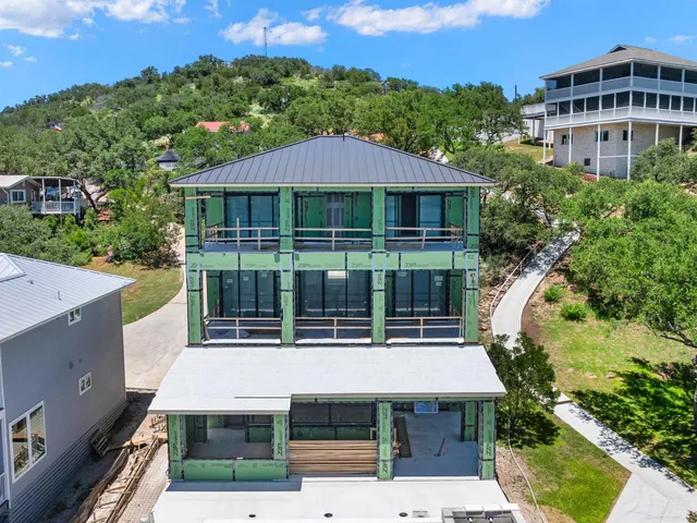 an aerial view of house with yard swimming pool and outdoor seating