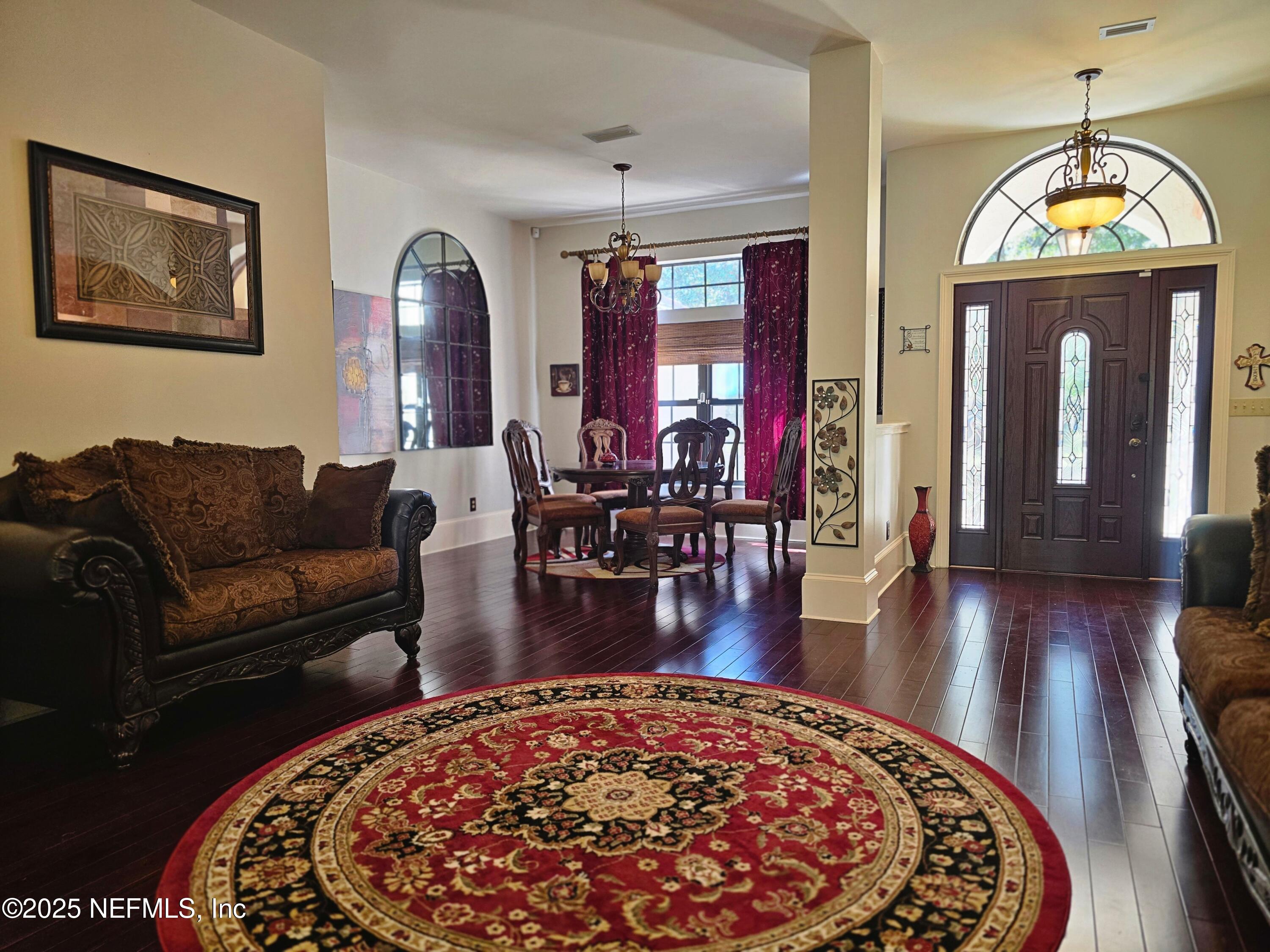 3600 Stratton Road Jacksonville, FL 32221 - Photo 3 of 10 a living room with furniture and a wooden floor