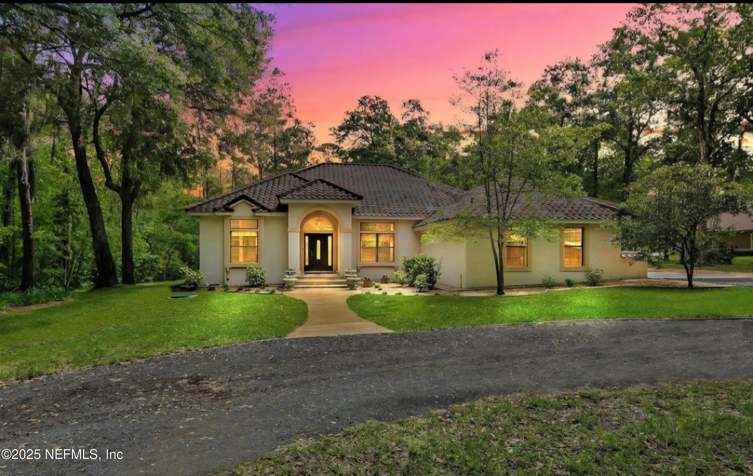 3600 Stratton Road Jacksonville, FL 32221 - Photo 10 of 10 a front view of a house with porch and garden
