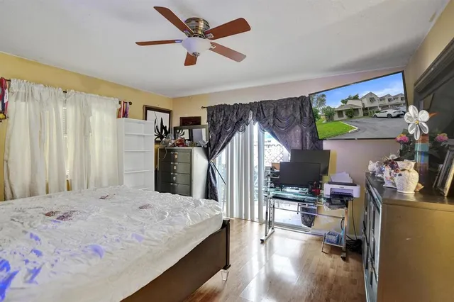 a very nice looking room with a large window and a flat screen tv