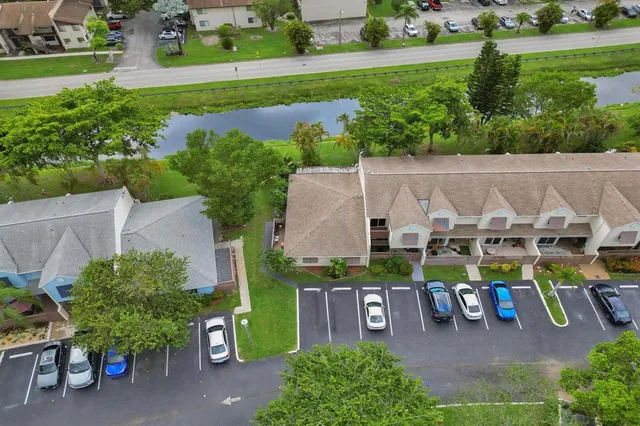 an aerial view of a house with outdoor space patio and mountain view in back yard