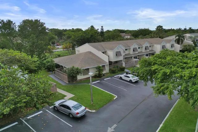 a balcony view with two chairs and a table