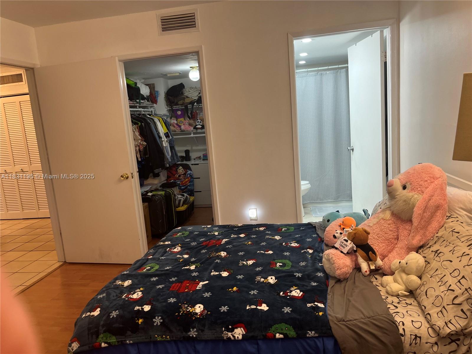 8251 Northwest 8th Street, Unit 214 Miami, FL 33126 - Photo 13 of 19 a bedroom with a bed and a window