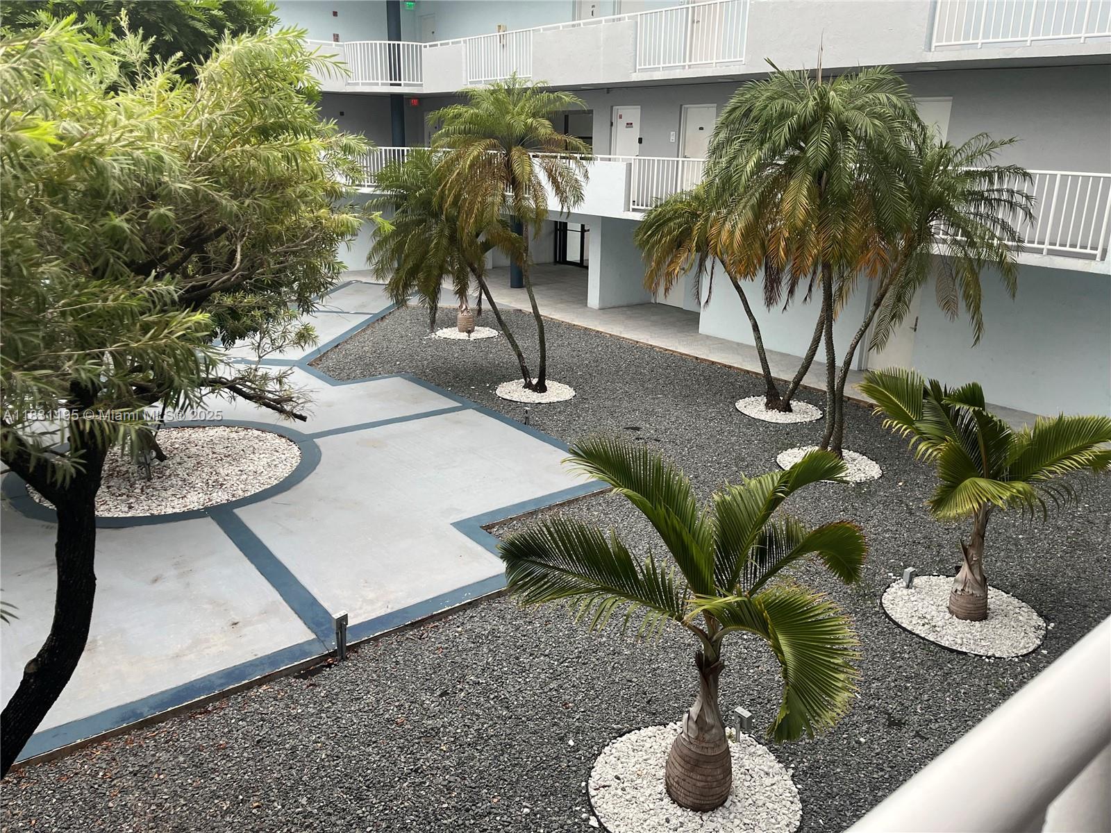 8251 Northwest 8th Street, Unit 214 Miami, FL 33126 - Photo 16 of 19 a vase of flowers sitting on a table