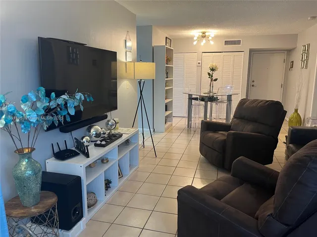 a view of a hallway with living room