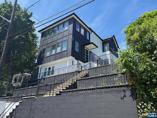 front view of a house with a small yard