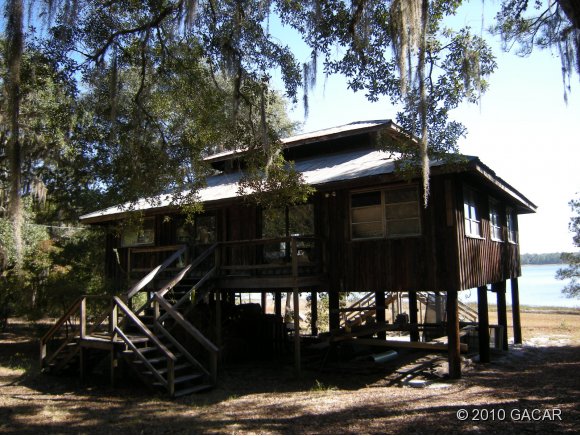 121 Persimmon Road Hawthorne, FL 32640 - Photo 1 of 1 Rustic Lake Home