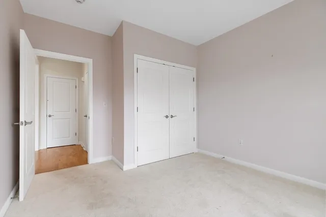 an empty room with closet area