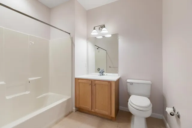 a bathroom with a toilet a sink and bathtub