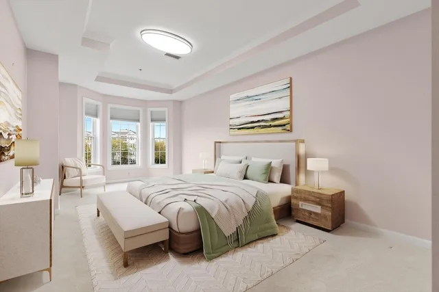 a bedroom with bed and a chandelier